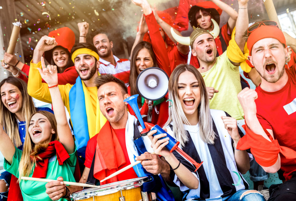 Football supporter fans friends cheering and watching soccer cup match